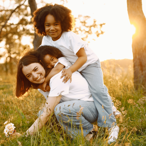 mother playing with her two child