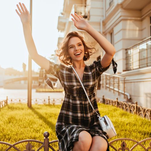laughing lady with waving hands